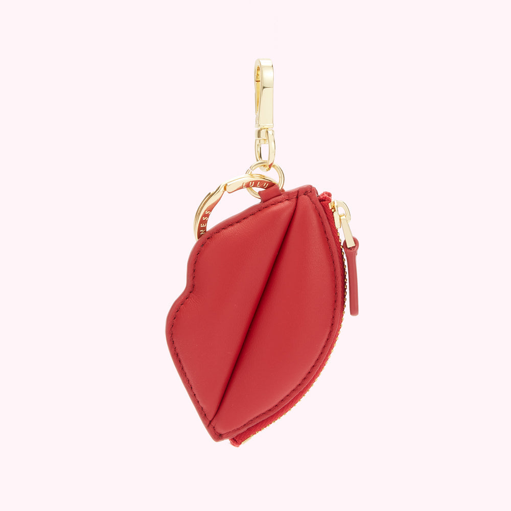 Red leather lip-shaped keyring with gold-tone hardware.