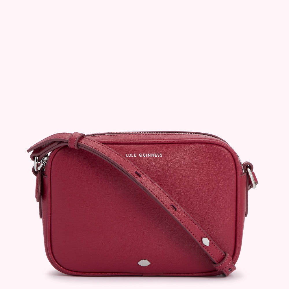 Pink Lulu Guinness crossbody bag.