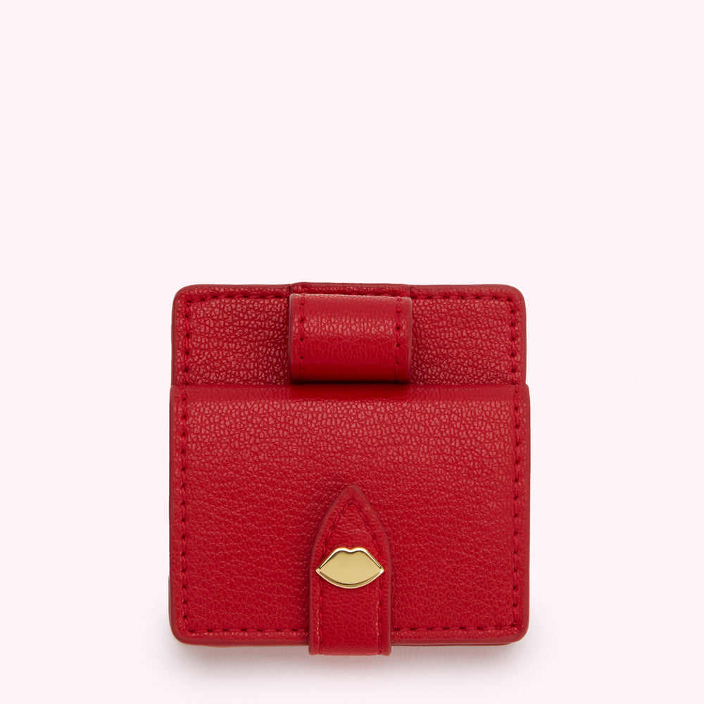 Red leather comapct mirrir and lipstick case with gold lip detail.