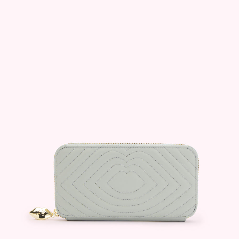 Light green quilted zip-around wallet with lip-shaped pattern and gold lip charm.