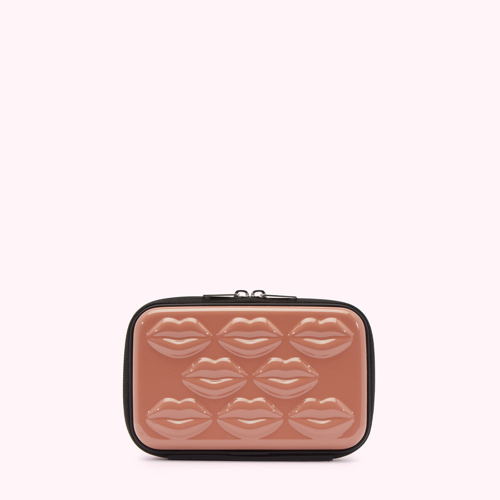 Dusty rose cosmetic bag with a black zipper and lips molded into the case.
