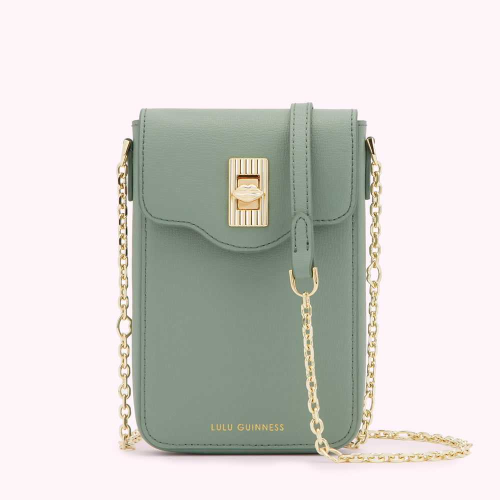 Sage green Lulu Guinness crossbody bag with gold chain strap and clasp.