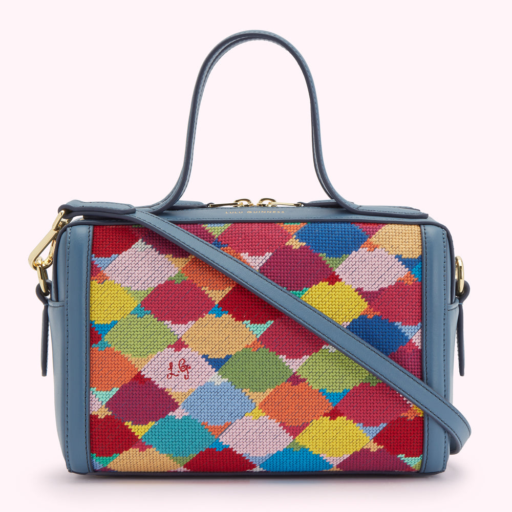 Blue leather Lulu Guinness handbag with a colorful needlepoint front panel.