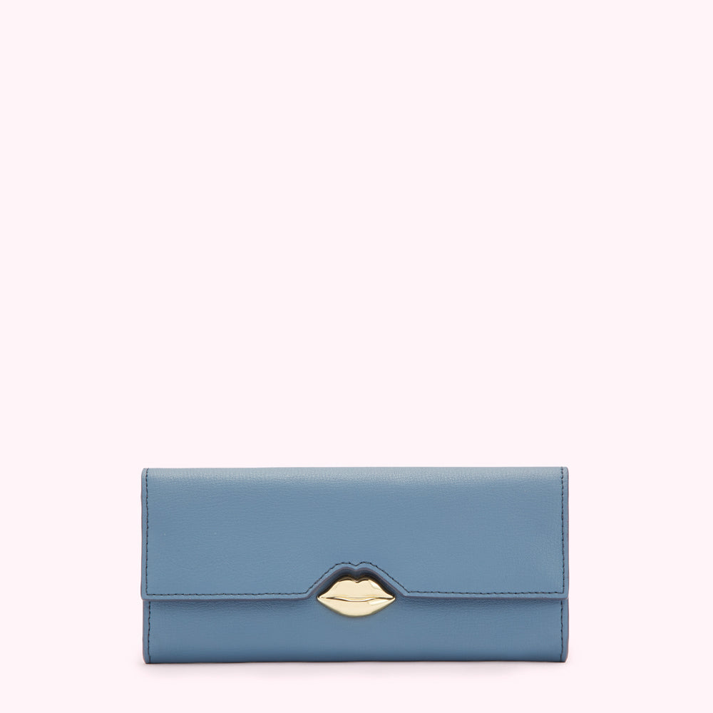 Dusty blue leather wallet with gold lip-shaped clasp against a white background.