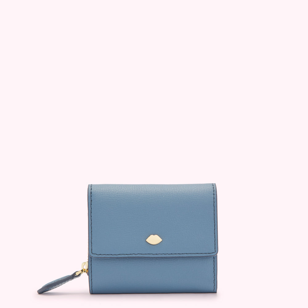 A small, light blue leather wallet with a gold lip-shaped logo.