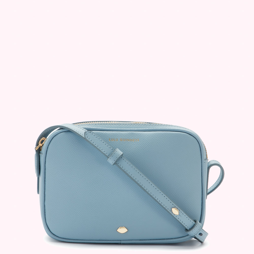 A light blue Lulu Guinness crossbody bag with gold hardware.