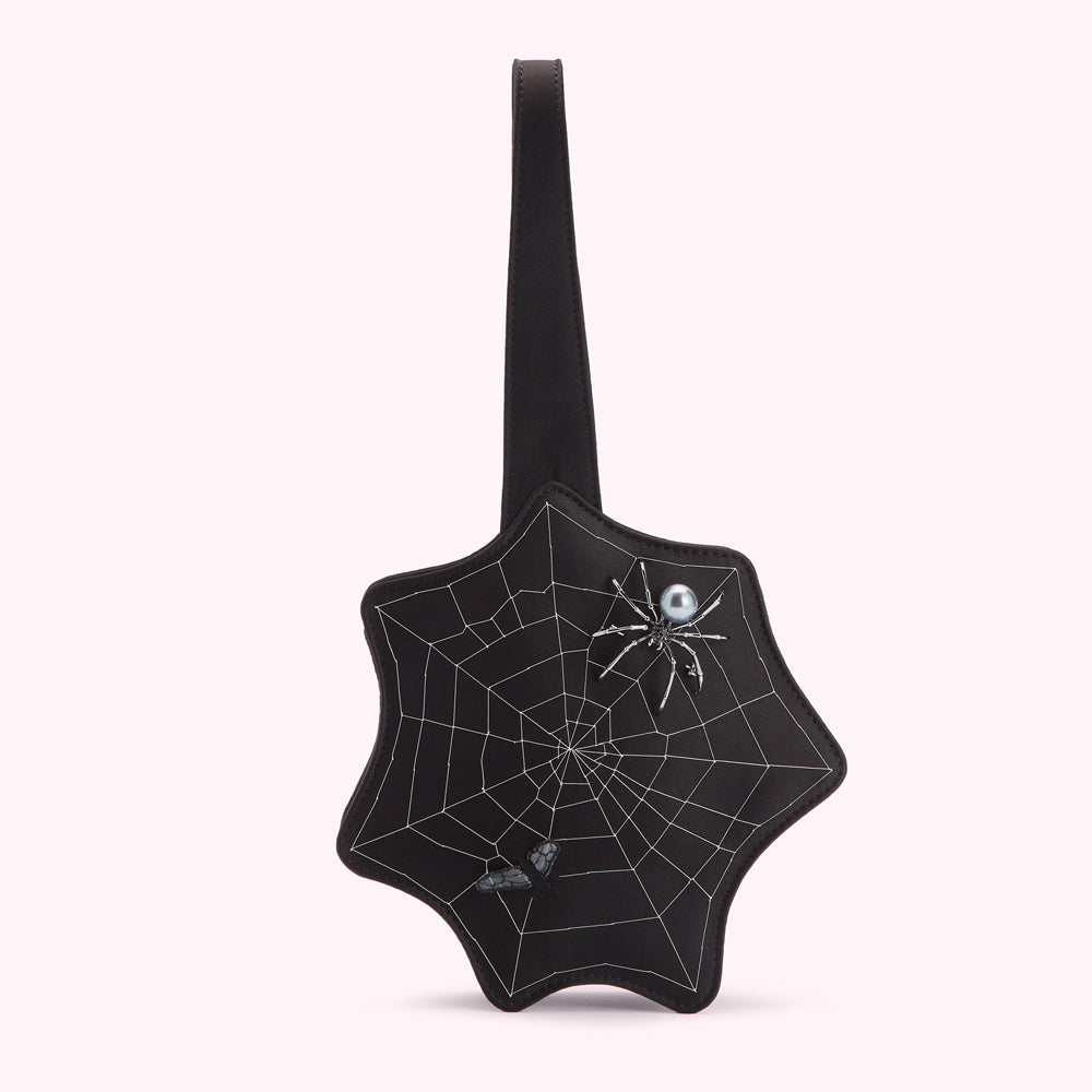 Black star-shaped bag with spiderweb design and spider and fly embellishments.