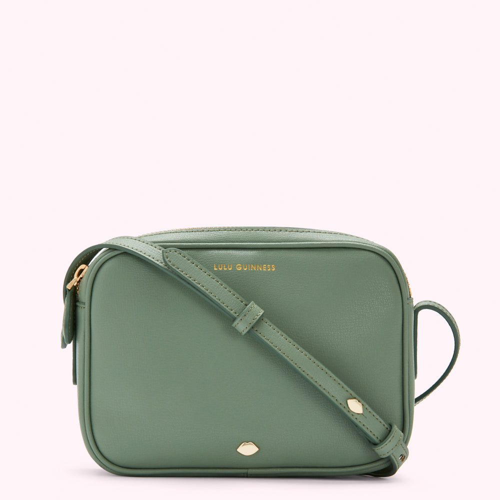 Sage green Lulu Guinness crossbody bag with gold hardware.