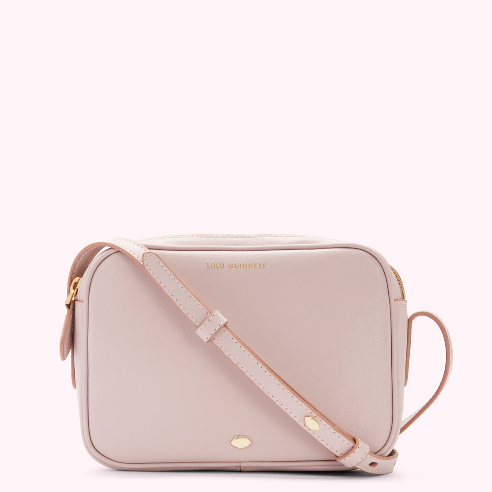 Pink Lulu Guinness crossbody bag.