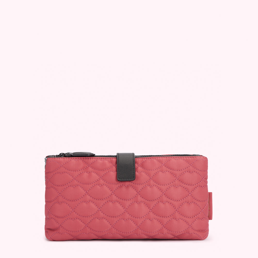 Dusty rose quilted zip-around pouch with black zipper and accent.
