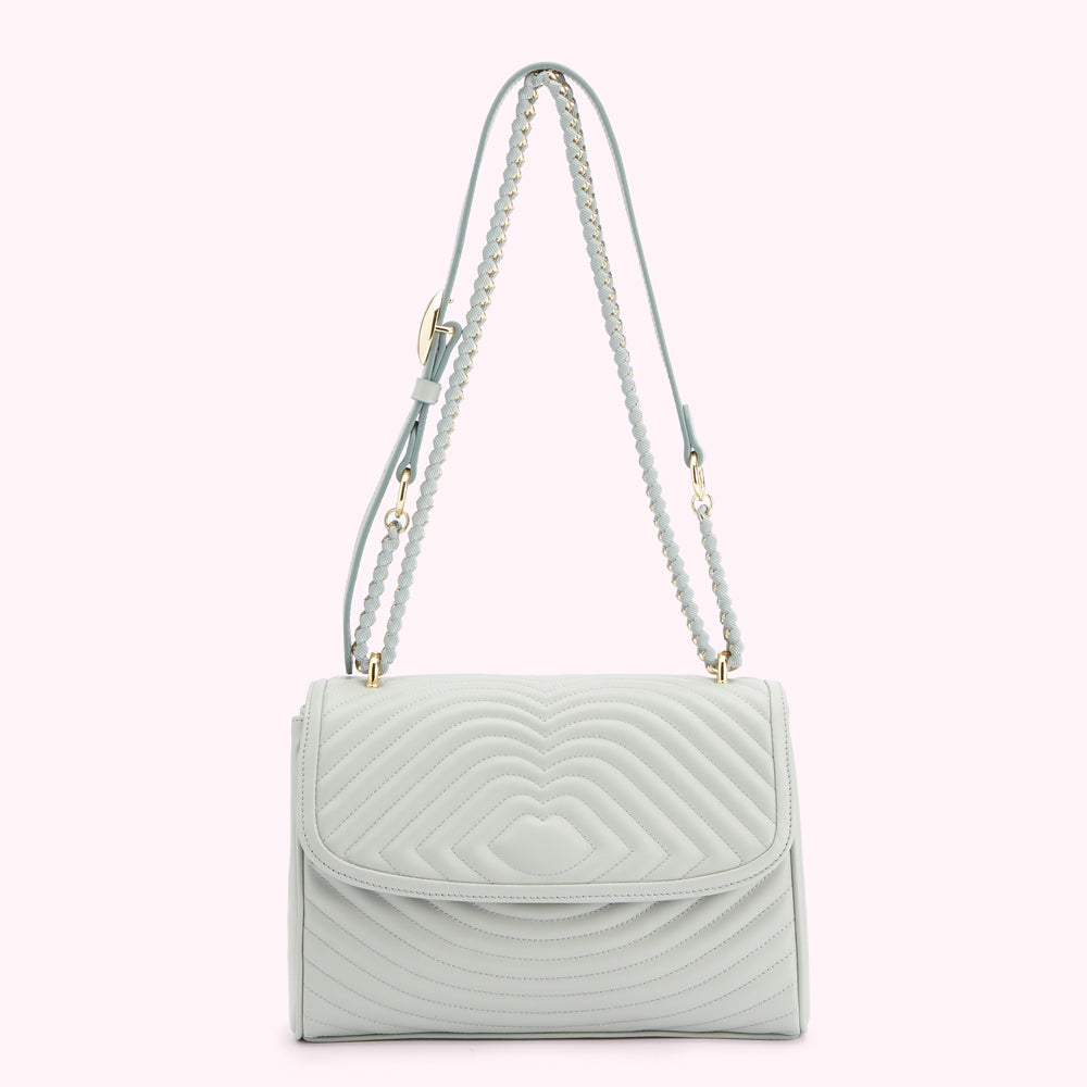 Light teal quilted shoulder bag with braided chain strap.