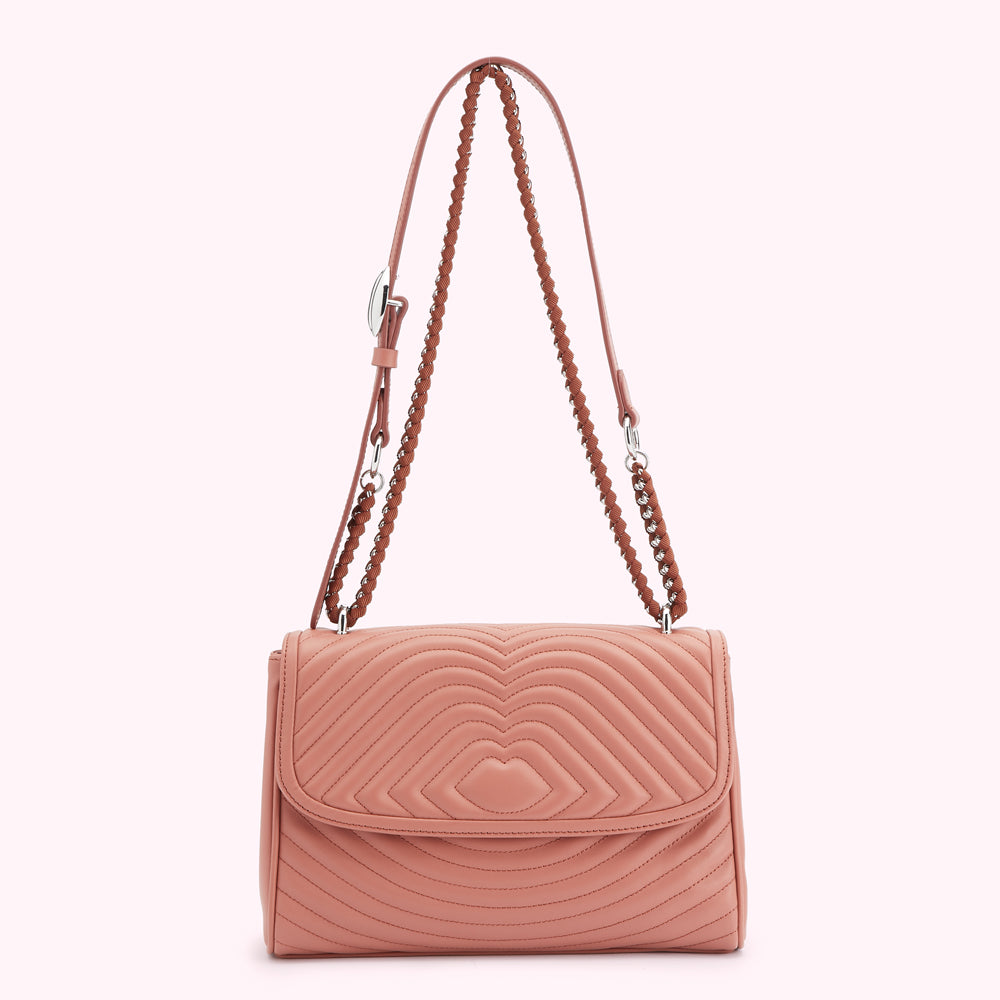 Dusty rose quilted shoulder bag with heart-shaped quilting and silver chain strap.