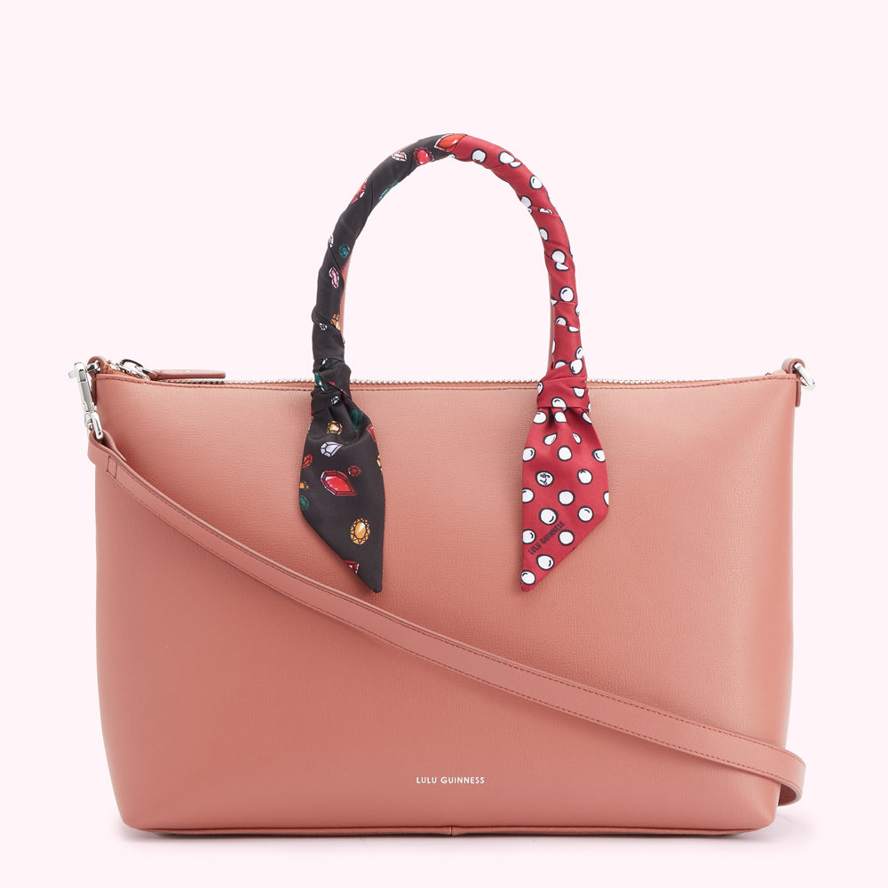Dusty rose Lulu Guinness tote bag with a detachable shoulder strap and decorative scarf handles.