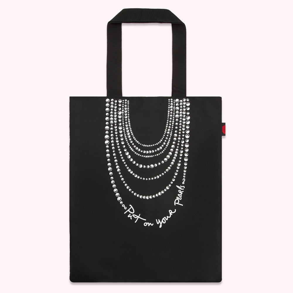 Black tote bag with a graphic of a pearl necklace and the text "Put on your Pearls".