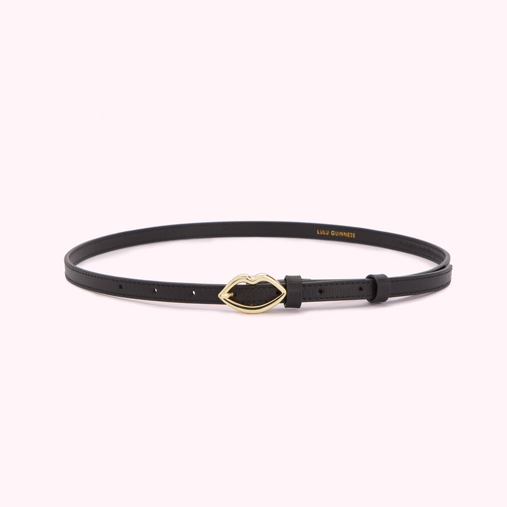 Black leather belt with gold lip buckle.