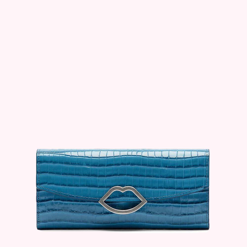 Teal crocodile-embossed leather wallet with silver lip-shaped clasp against a white background.