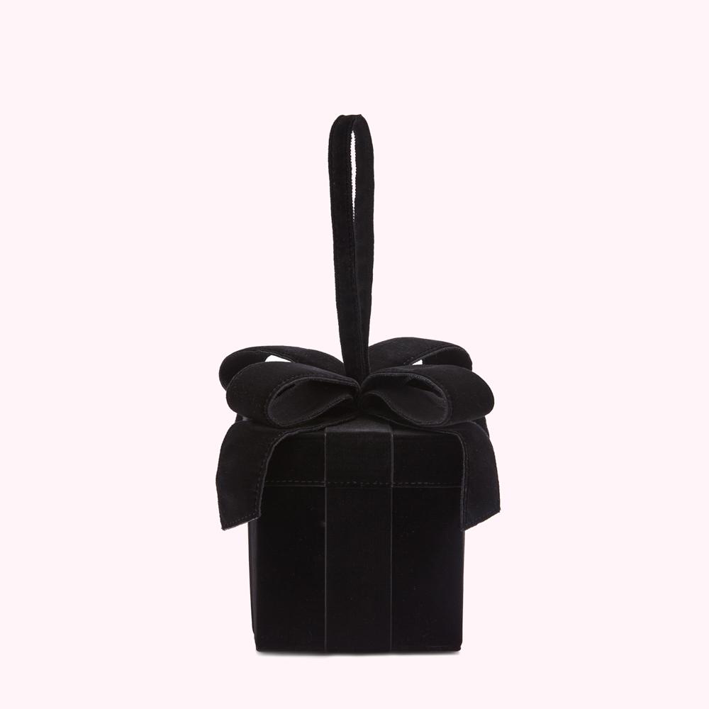 Black velvet gift box shaped handbag with a top handle and large bow.