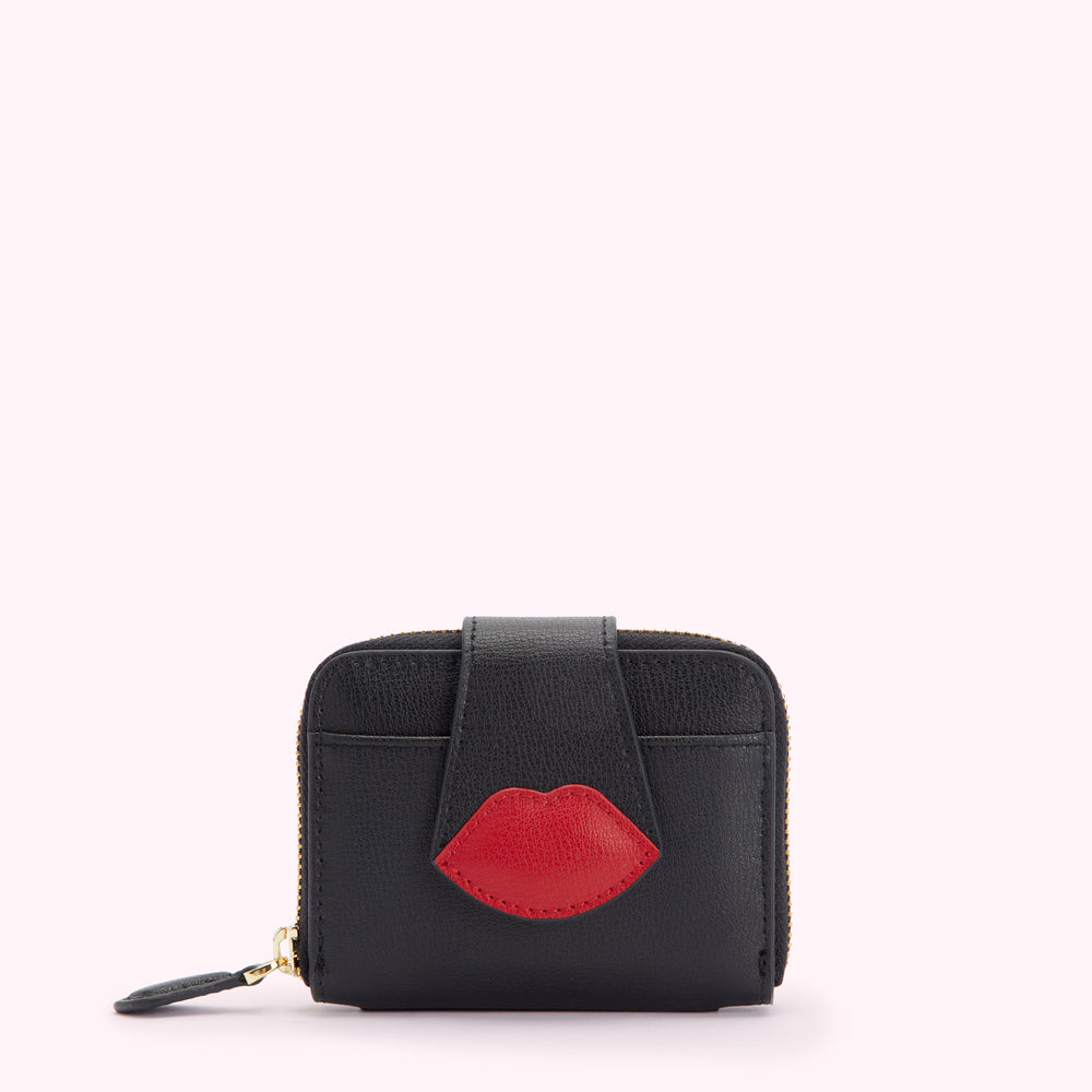 Black leather wallet with a red lip detail.
