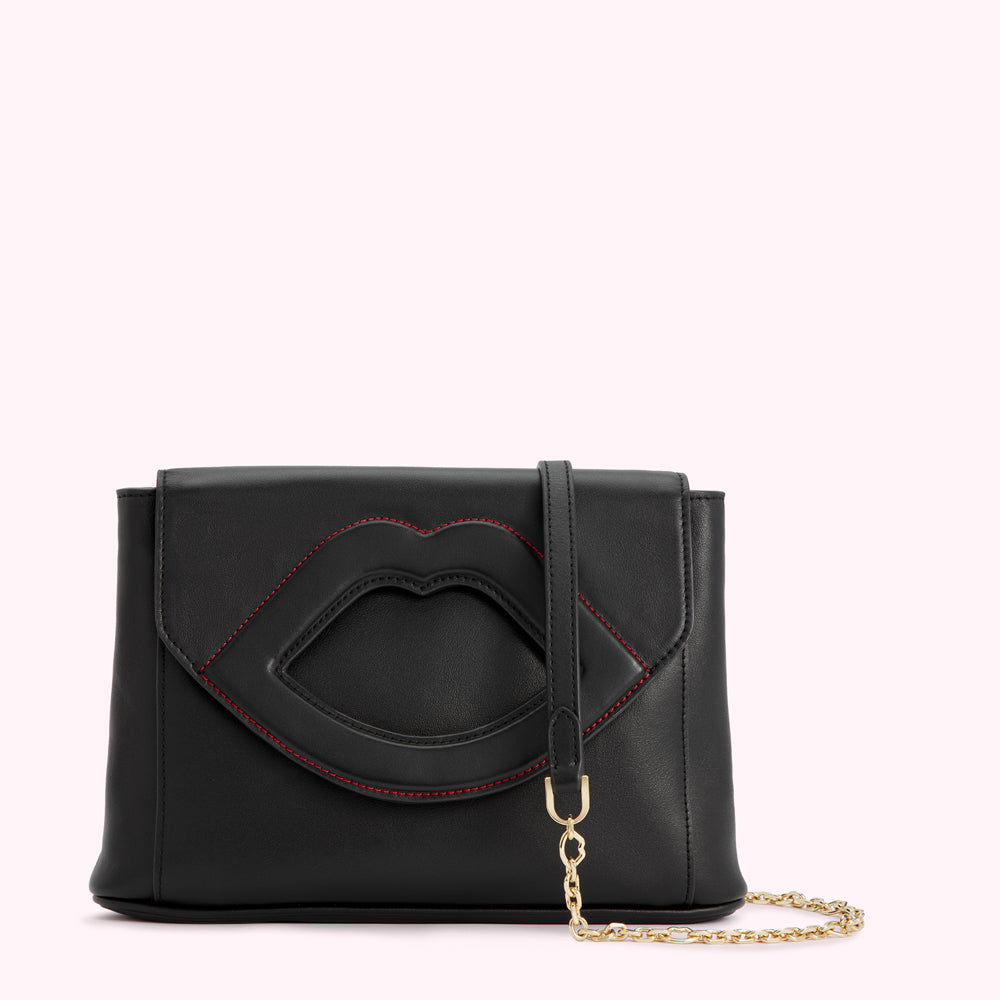 Black leather clutch with red stitched lip detail and gold chain strap.