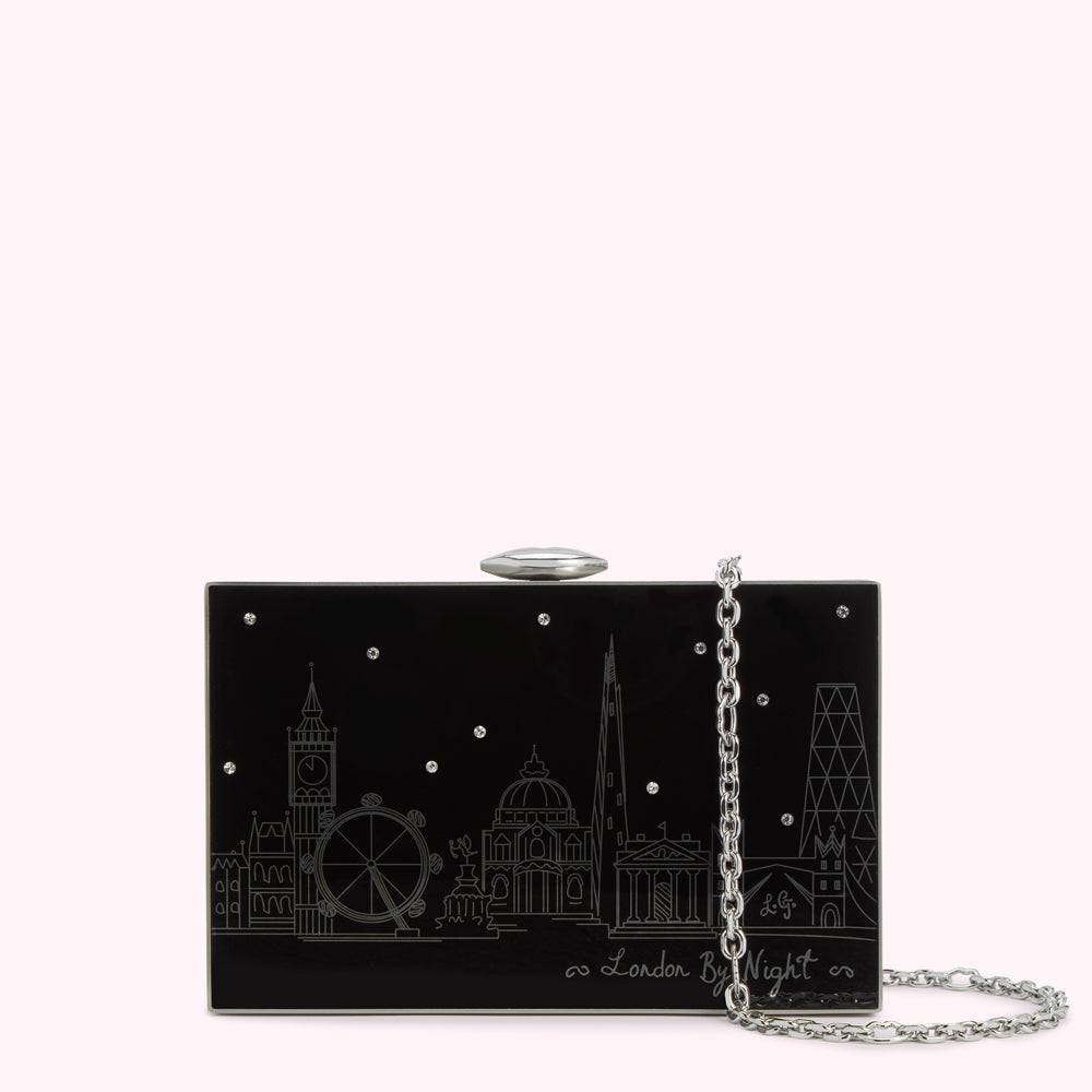 Black rectangular clutch with silver chain strap and etched London skyline design.
