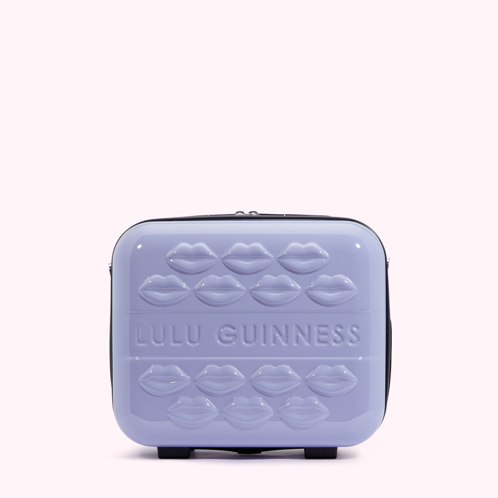Lilac Lulu Guinness makeup case with embossed lips.