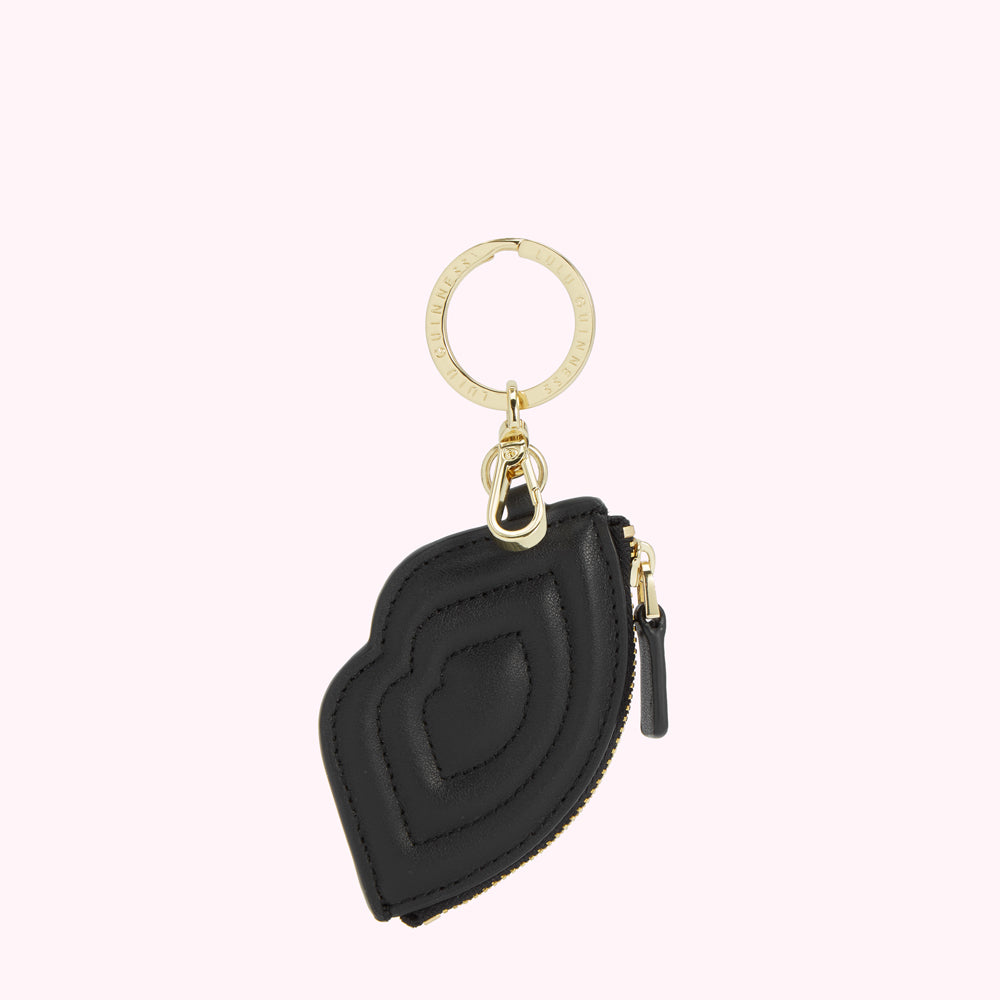Black quilted leather lip-shaped key chain with gold-toned hardware.