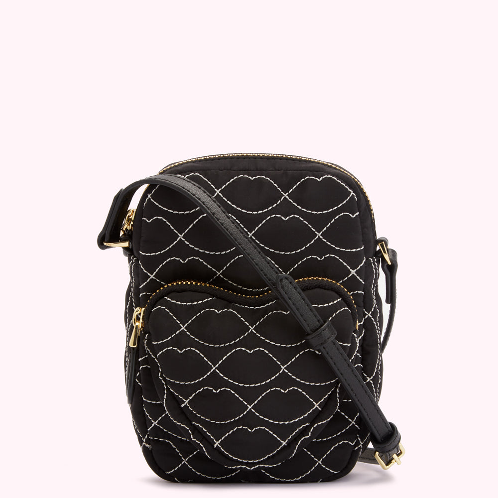 Black quilted crossbody bag with white lip pattern.