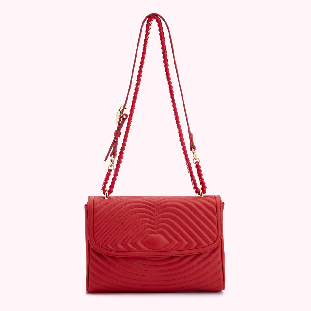 Red quilted shoulder bag with gold chain strap.