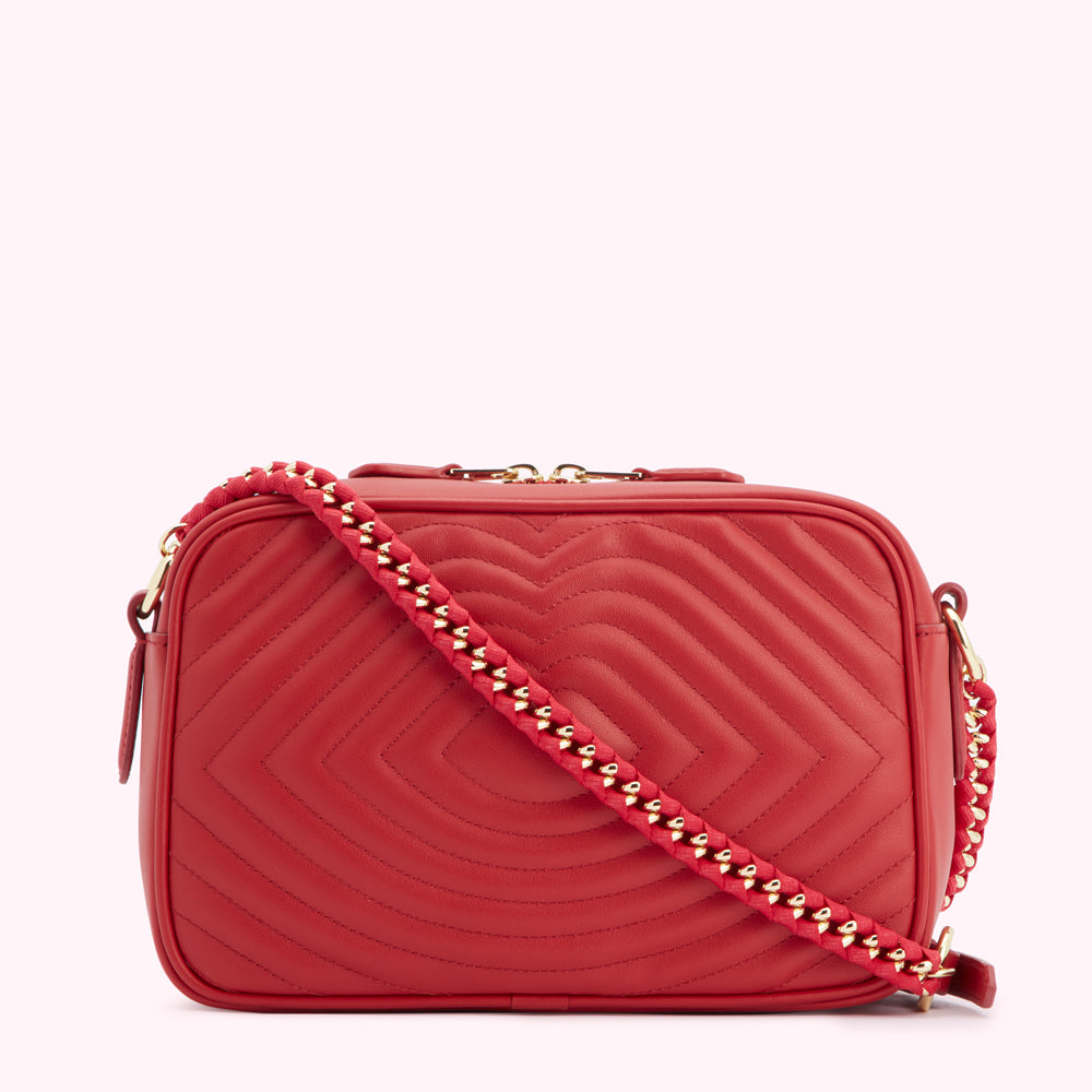 Red quilted crossbody bag with gold chain strap.