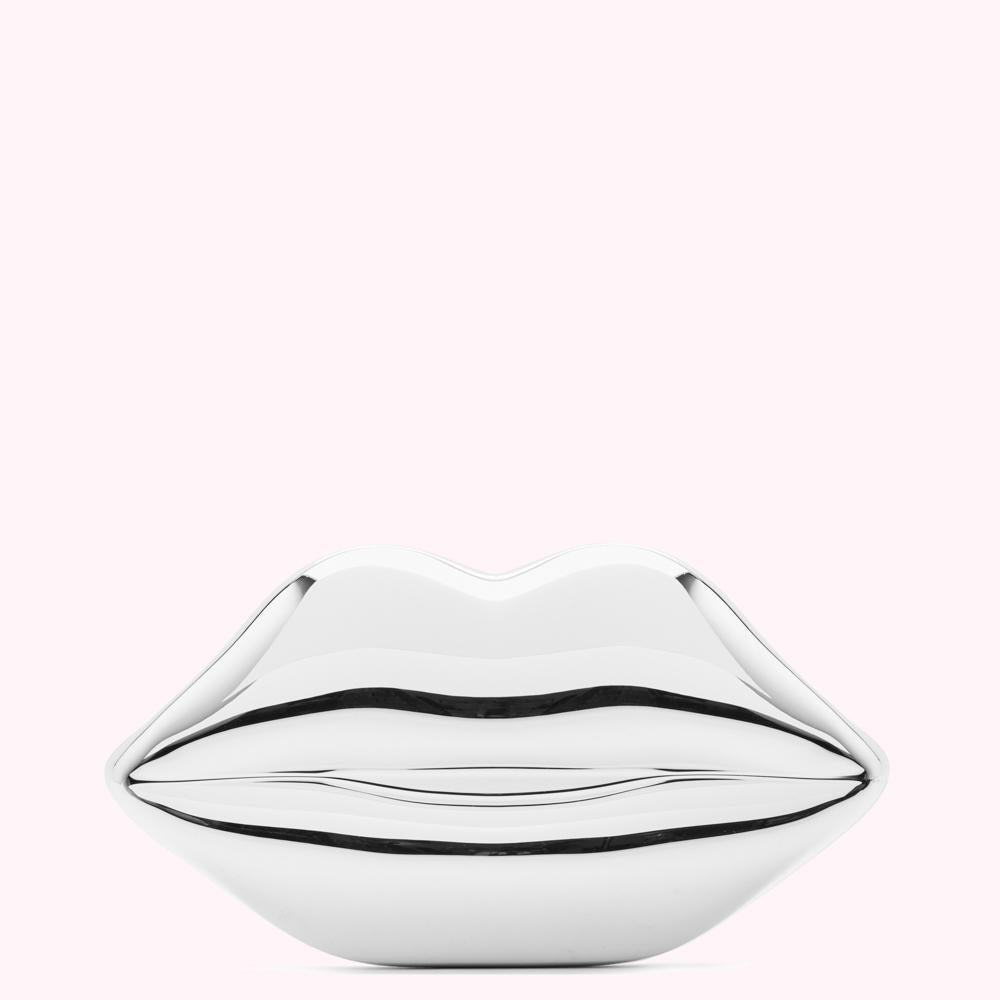 Silver lips sculpture against a white background.