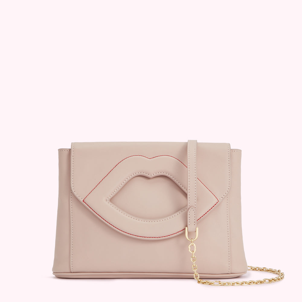 Beige leather crossbody bag with a lip-shaped cutout detail.