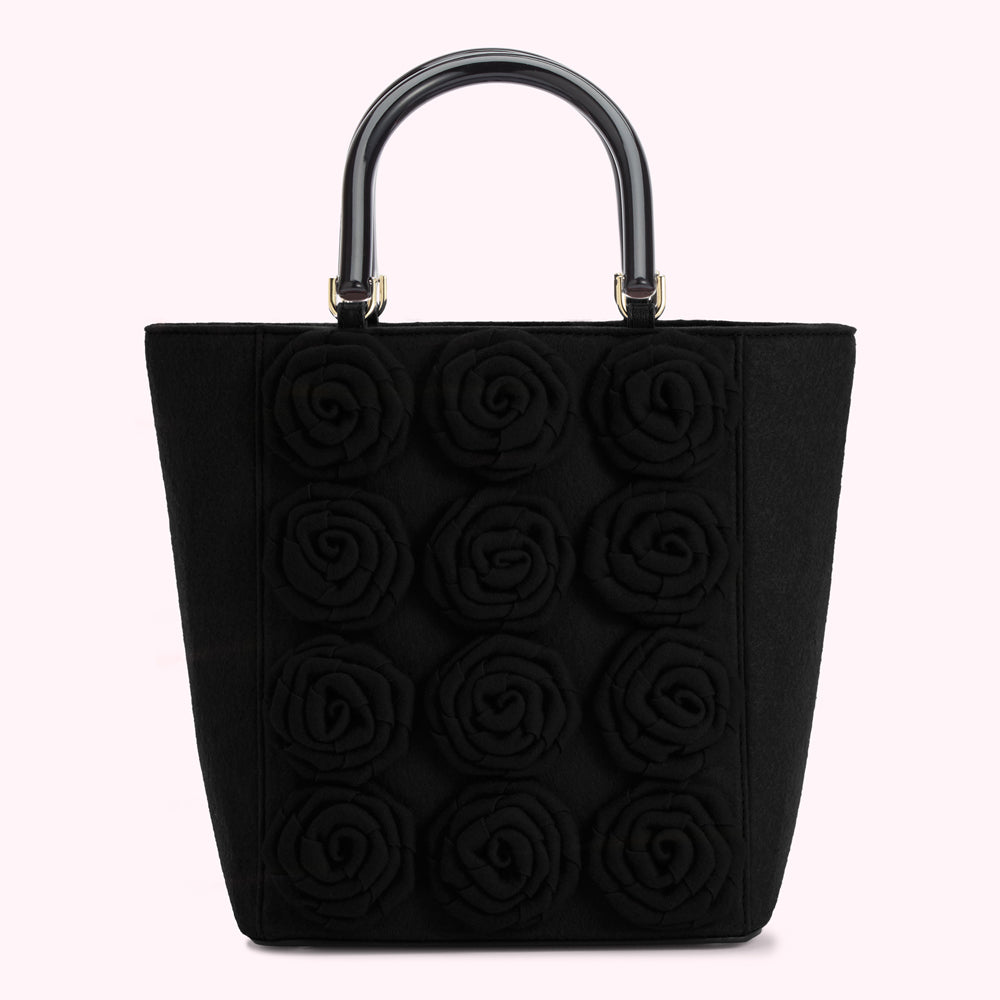 Black felt tote bag with black rose appliqué and black handles.