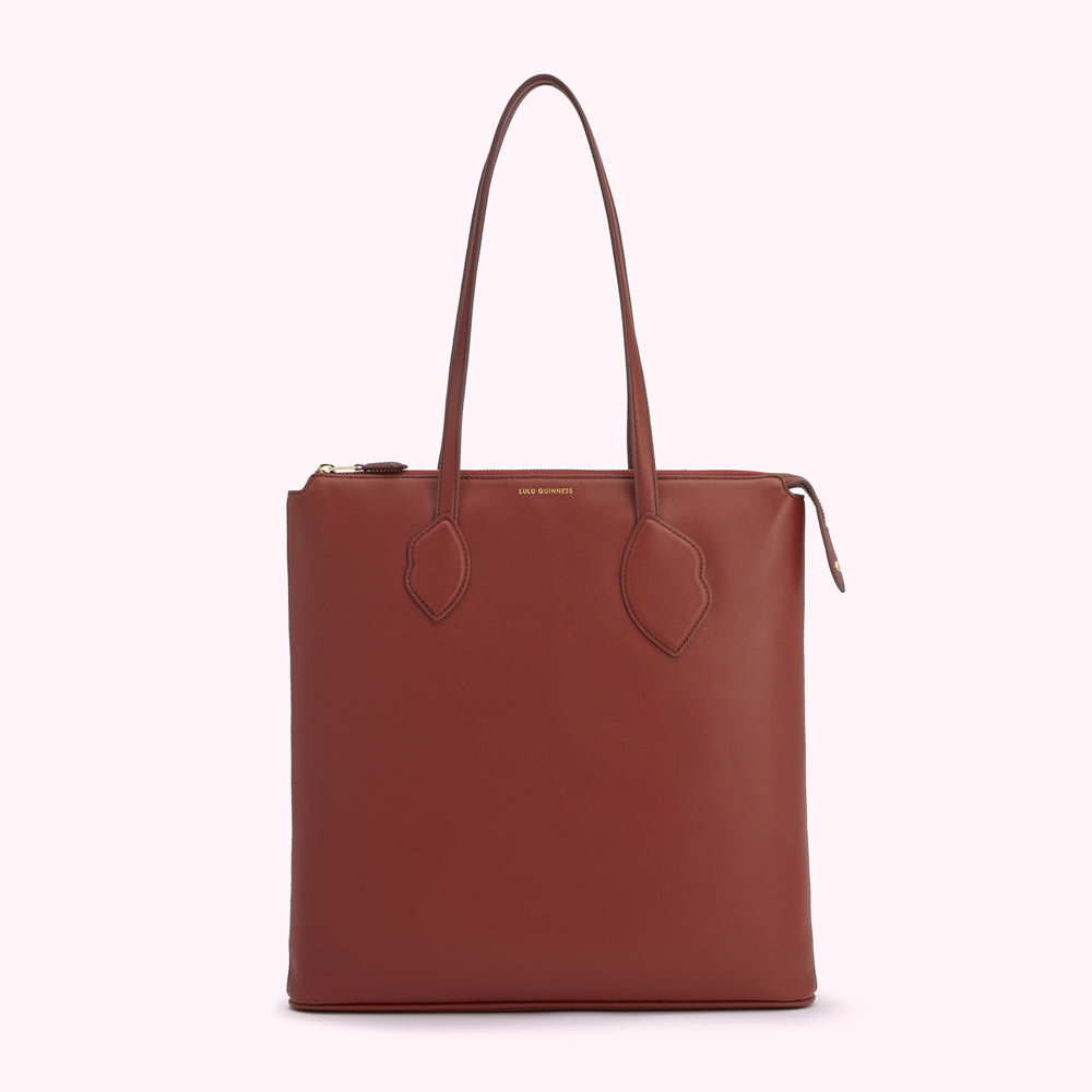 A brown leather Lulu Guinness tote bag with gold zipper and hardware.