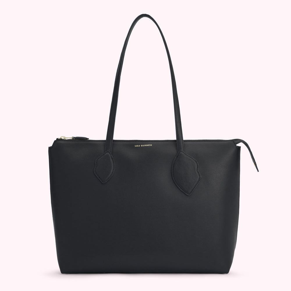 Black Lulu Guinness tote bag with gold zipper and lip details.