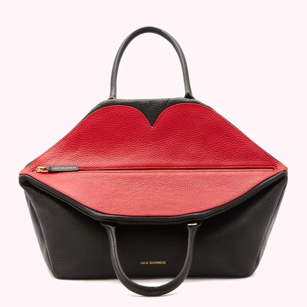 Black and red leather Lulu Guinness handbag shaped like a pair of lips.