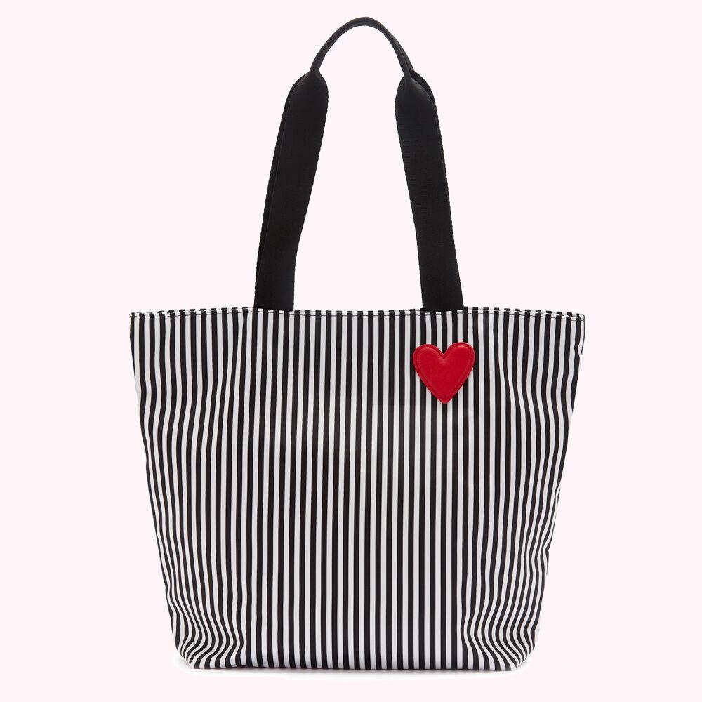 Black and white striped tote bag with a red heart detail.