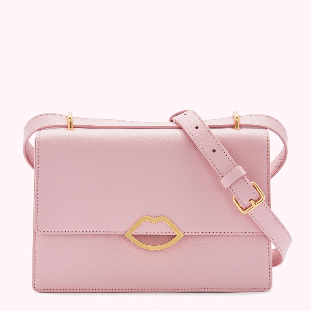 Pink leather crossbody bag with gold lip detail.
