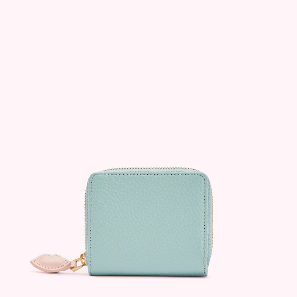 Light blue leather zip-around wallet with pink heart zipper pull.
