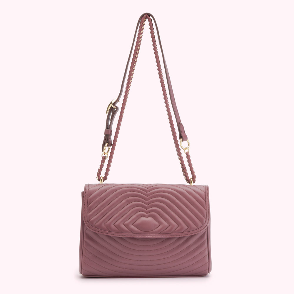 Dusty rose quilted shoulder bag with gold chain strap.