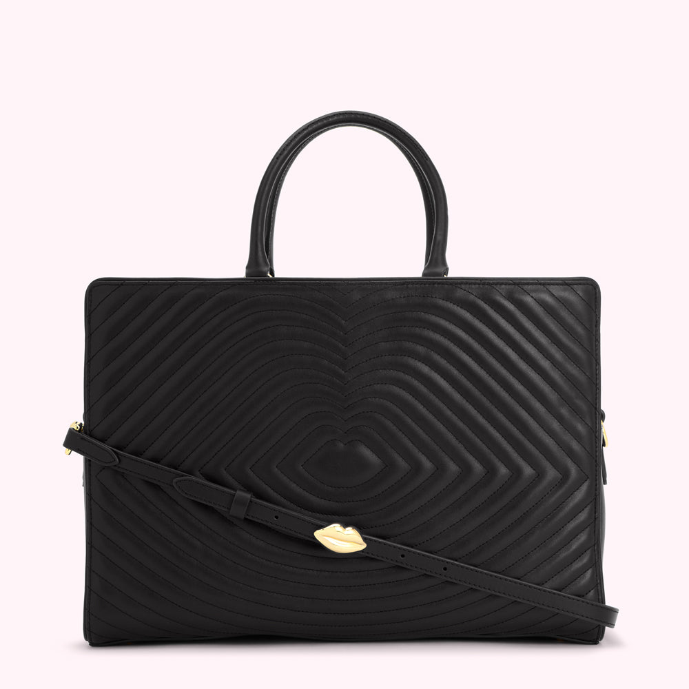 Black quilted leather handbag with gold lip-shaped detail.