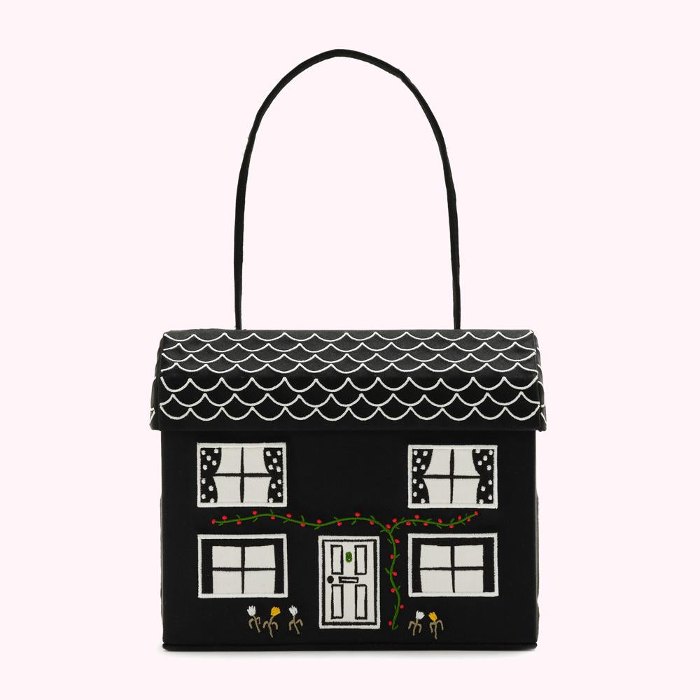 Black handbag shaped like a house with white details.