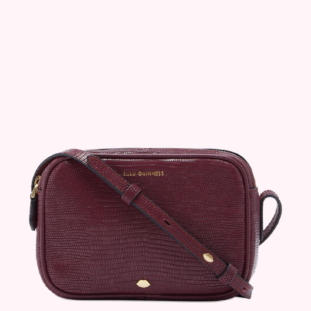 Burgundy Lulu Guinness crossbody bag with snakeskin texture.