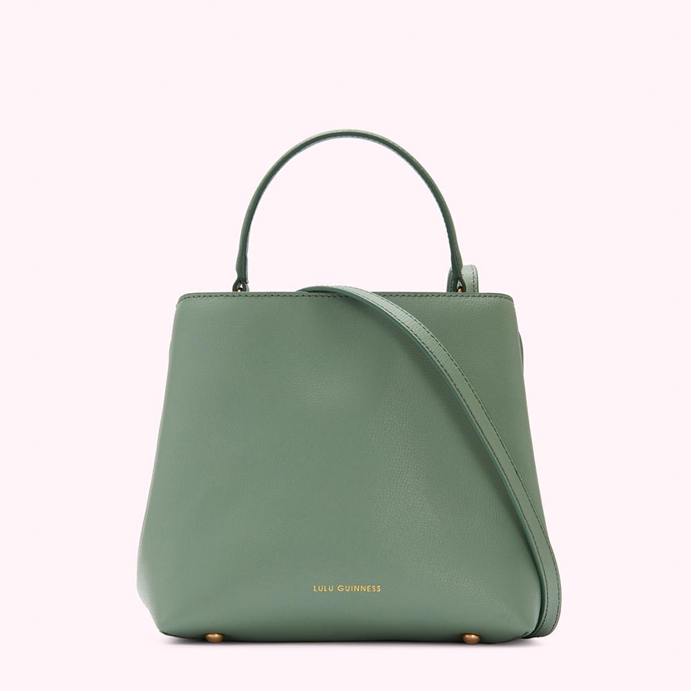 Sage green Lulu Guinness satchel bag with top handles and a shoulder strap.