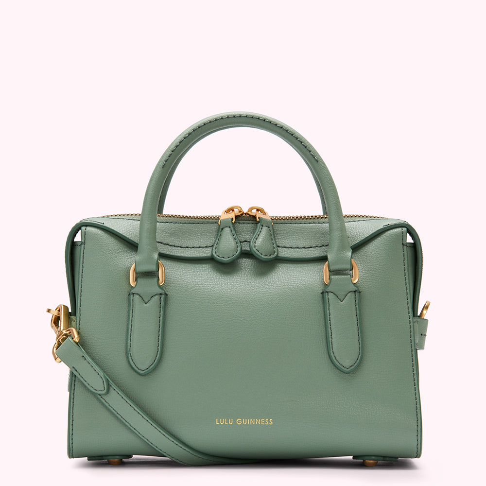 Sage green Lulu Guinness satchel handbag with gold hardware and a detachable shoulder strap.