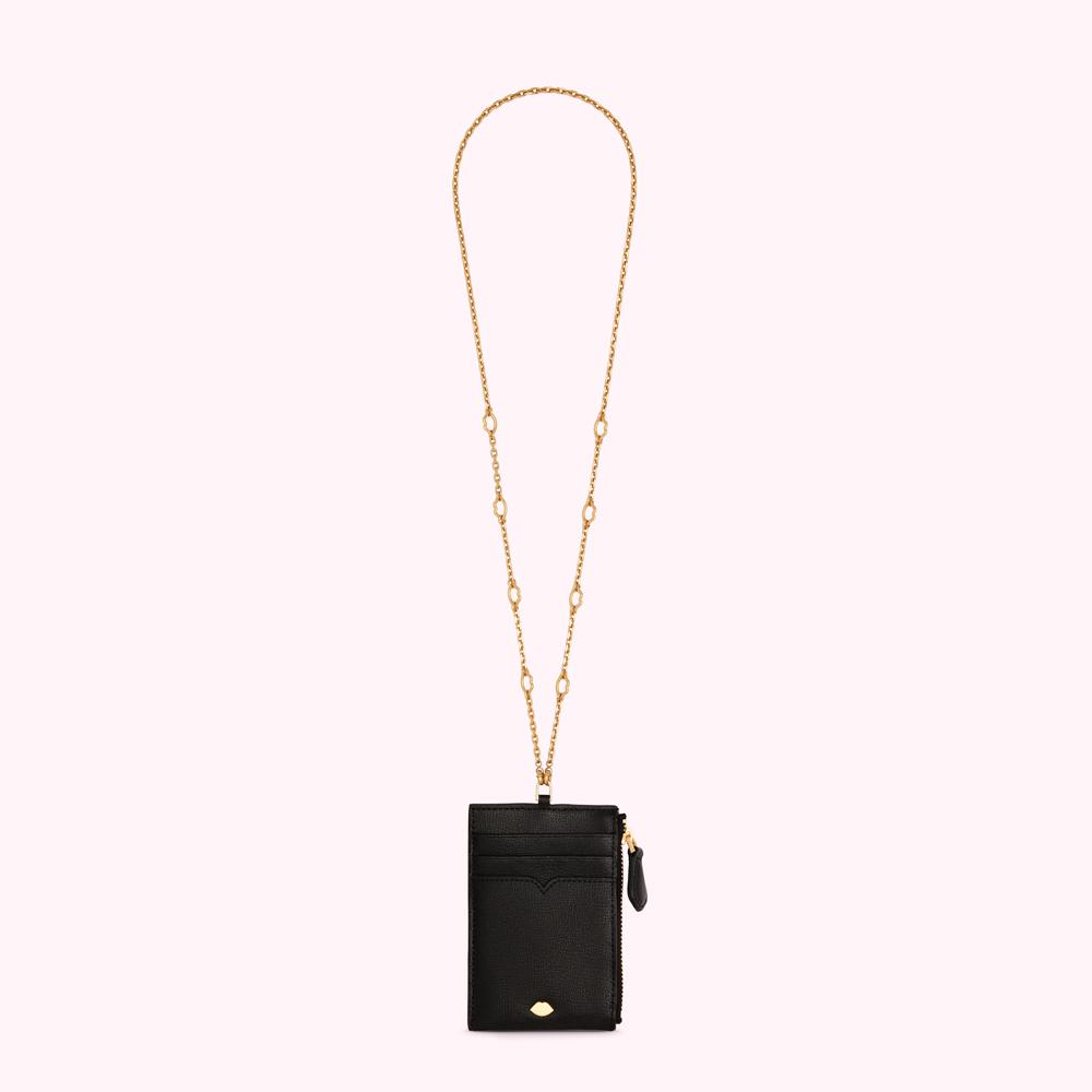 Black leather card holder with gold chain.