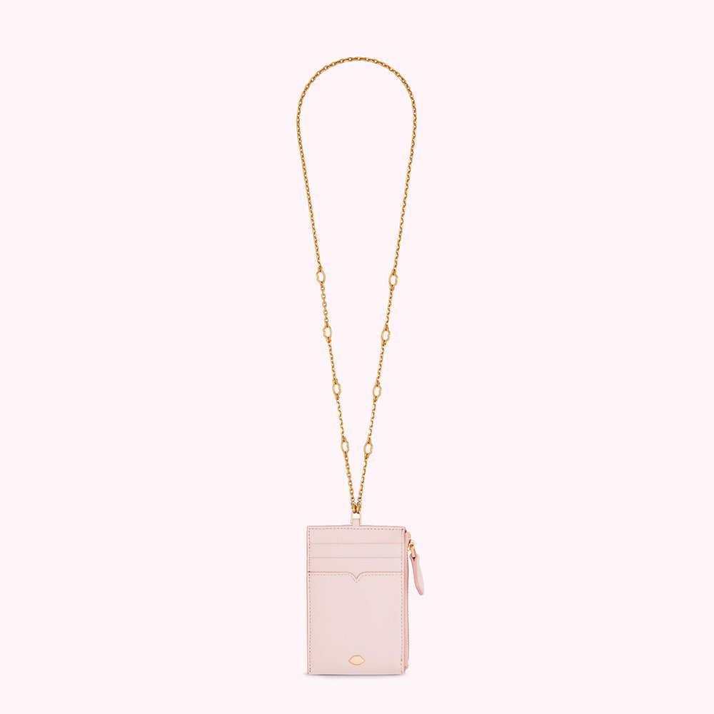 Pink leather cardholder with gold chain strap.