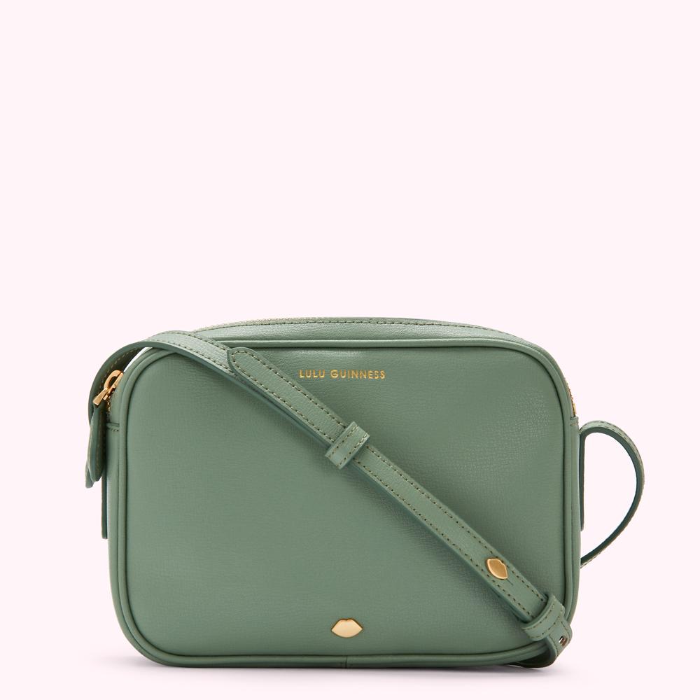 Sage green Lulu Guinness crossbody bag with gold hardware.