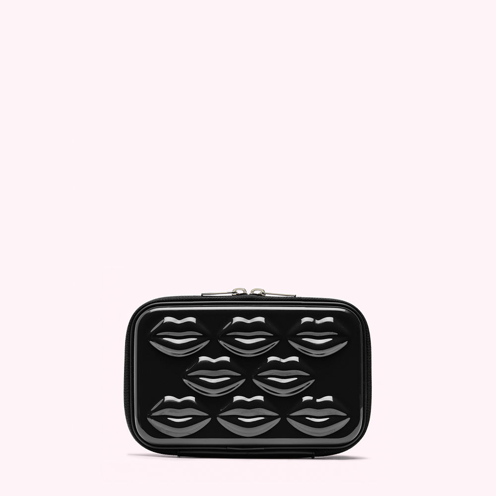 Black rectangular cosmetic bag with embossed lip designs.