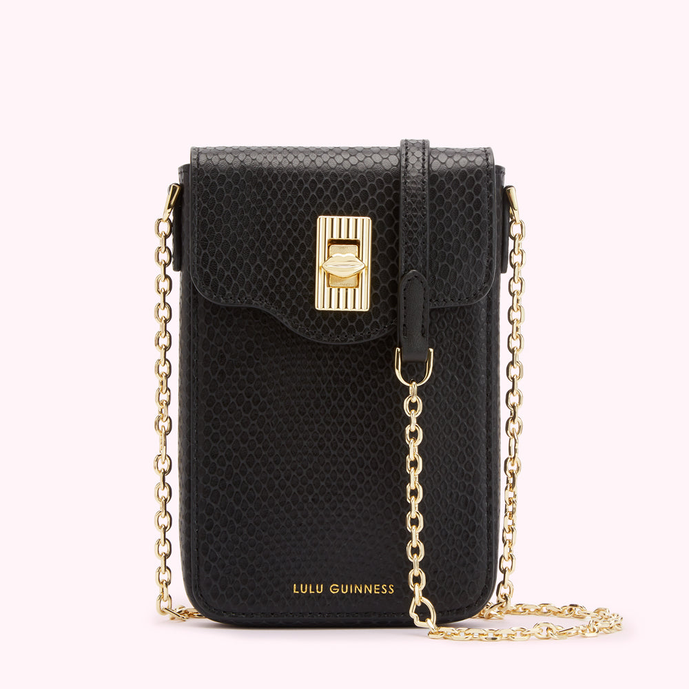 Black Lulu Guinness crossbody bag with gold chain strap and clasp.