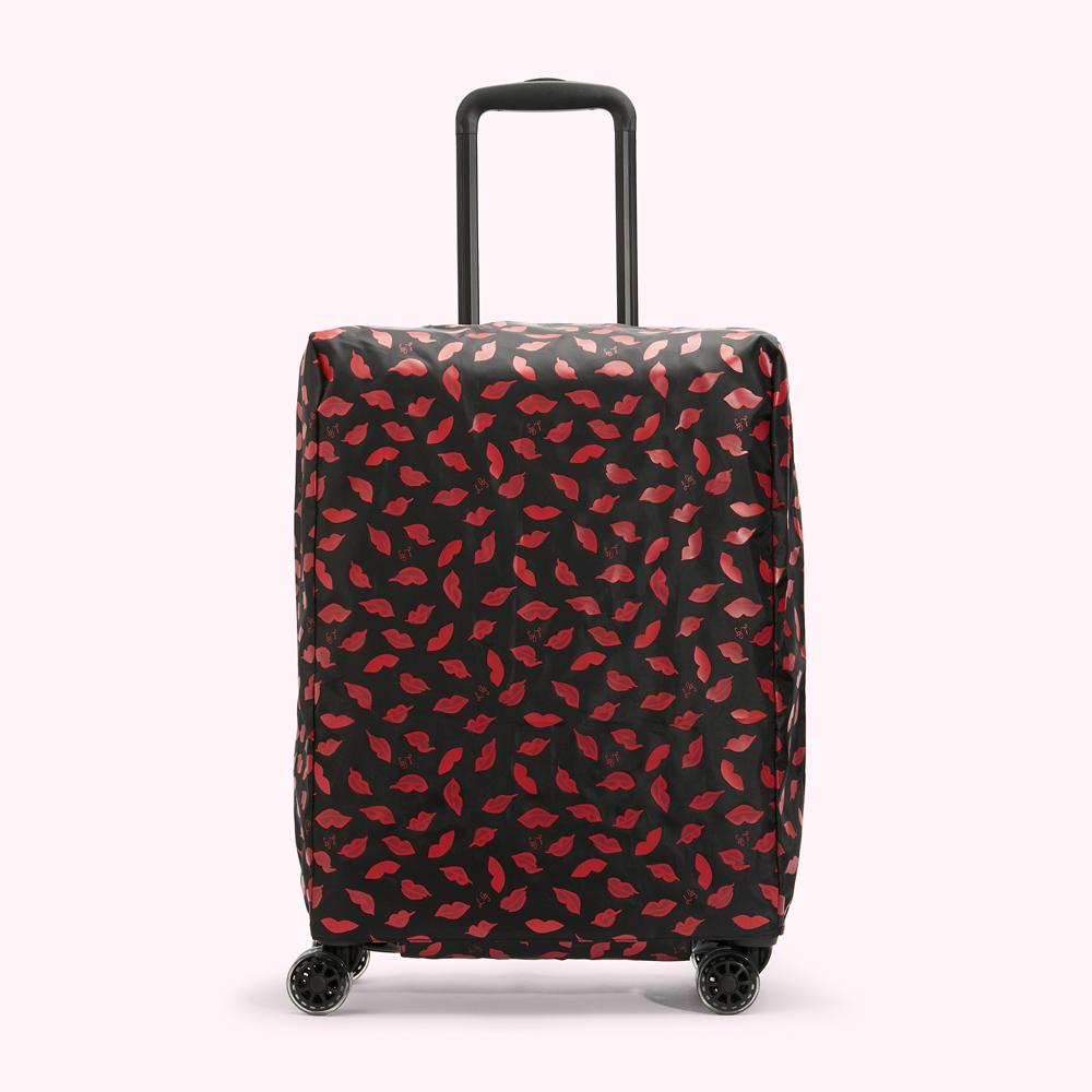 Black suitcase with red lips pattern.